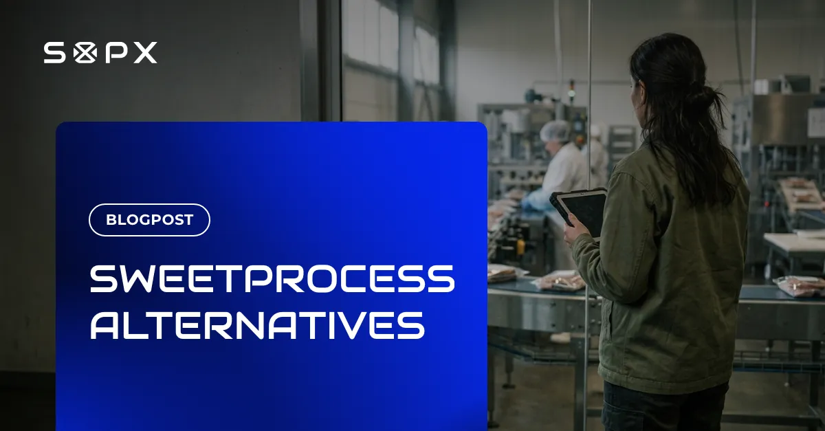 Operations lead holding a tablet at a glass partition overlooking a food production packing line.
