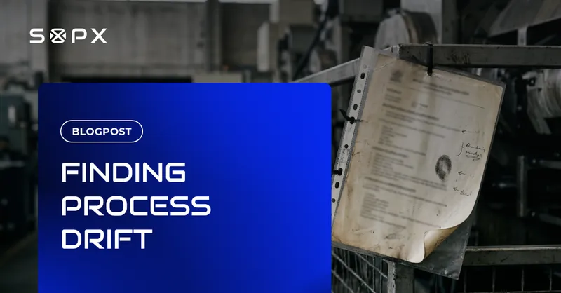 A sun-faded printed work instruction in a scuffed plastic sleeve, zip-tied to a machine guard on a factory floor, smudged with a thumbprint and marked up with handwritten corrections in the margin.