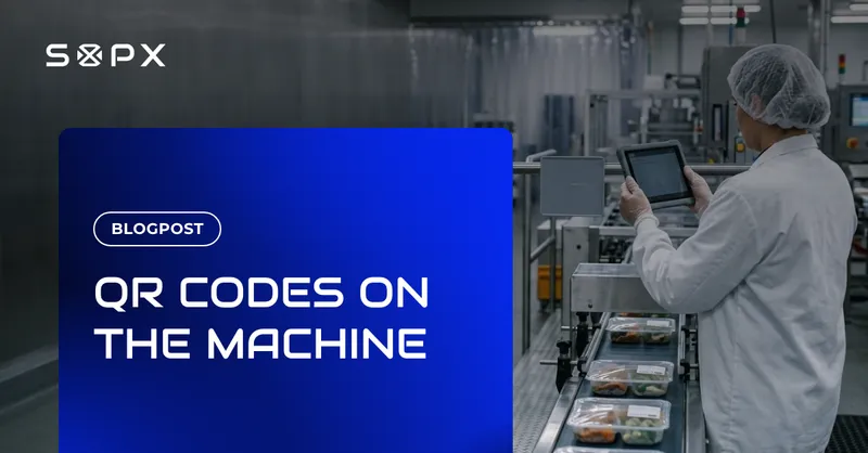 A worker beside a food packing line holding a tablet up to a printed QR code mounted on the machine guard.