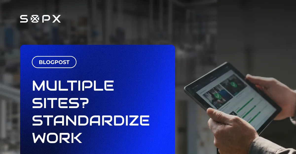Operations manager reviewing standardized SOPs followed the same way across multiple sites on a tablet.